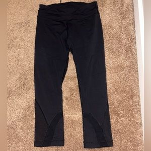 Lululemon leggings- Black with back zipper band pocket. *Small hole in one leg*